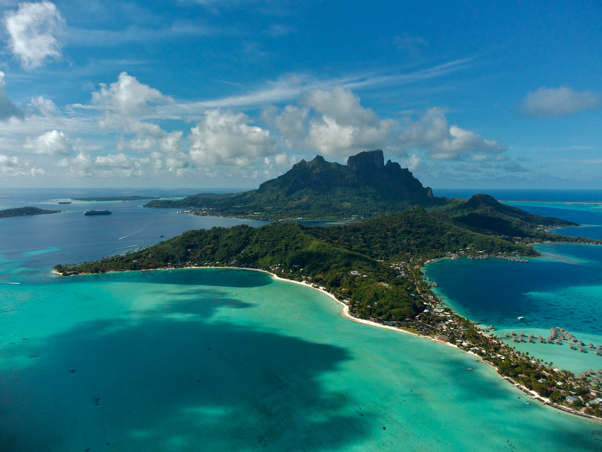 an aerial view of an island in the middle of the ocean